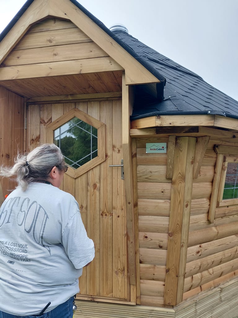 Mrs Strugnall at cabin entrance